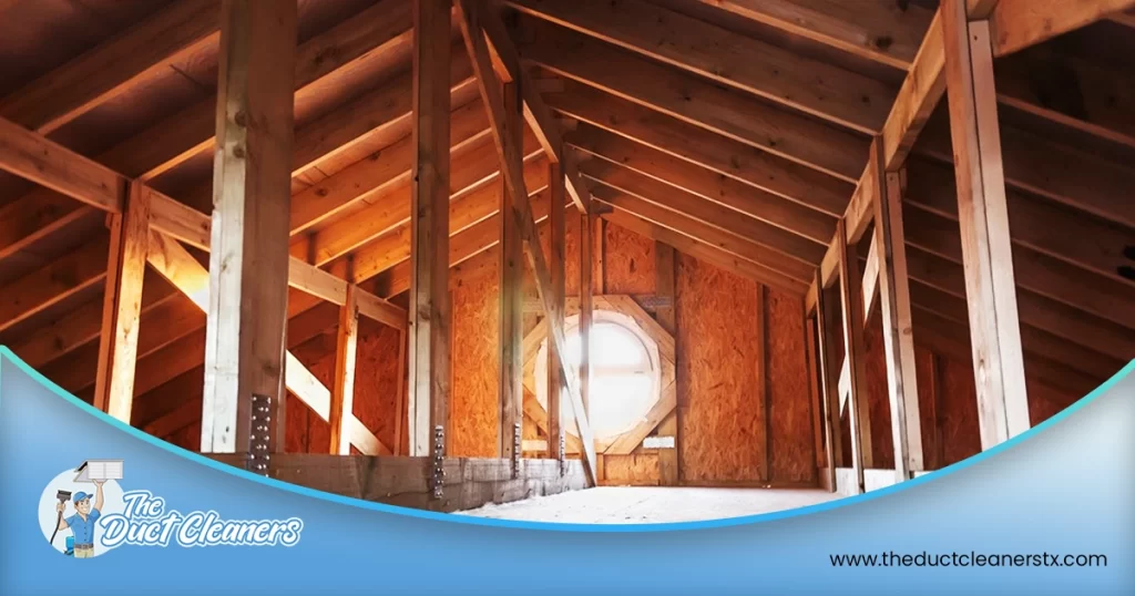 Shows an image of an attic without insulation.