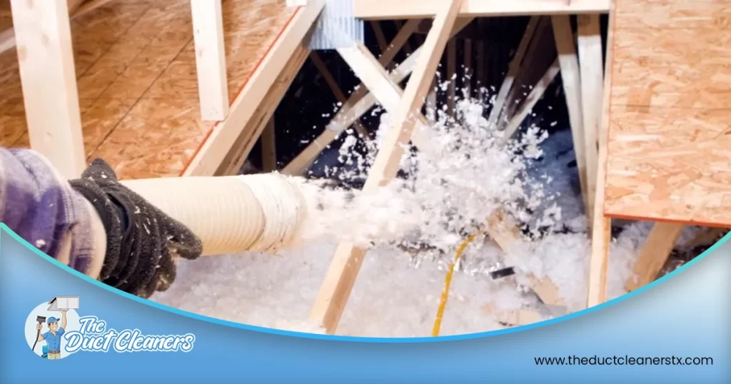 Shows an image of a technician installing insulation in the attic.