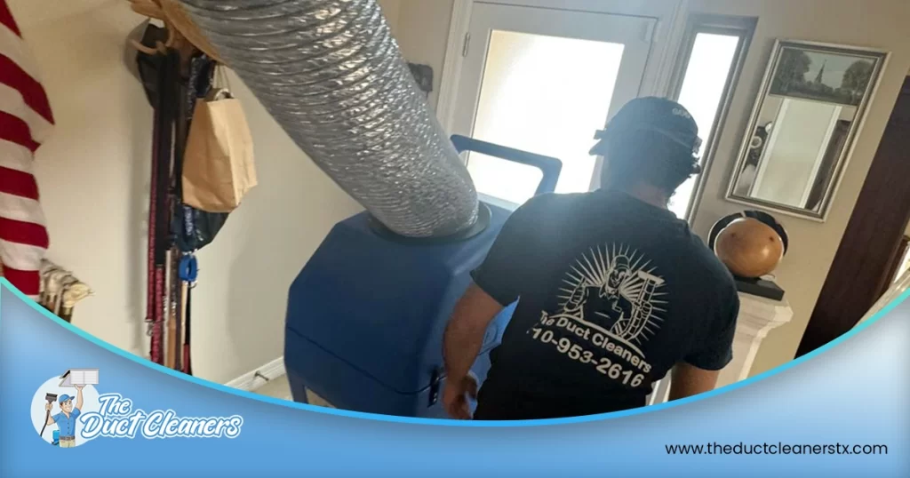 Shows an image where a technician can be seen cleaning the air ducts inside the customer's home.