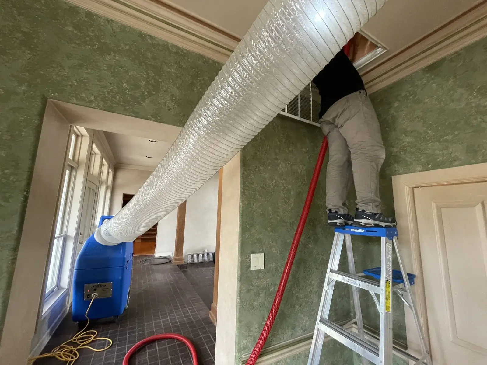 Air duct cleaning inside a residence