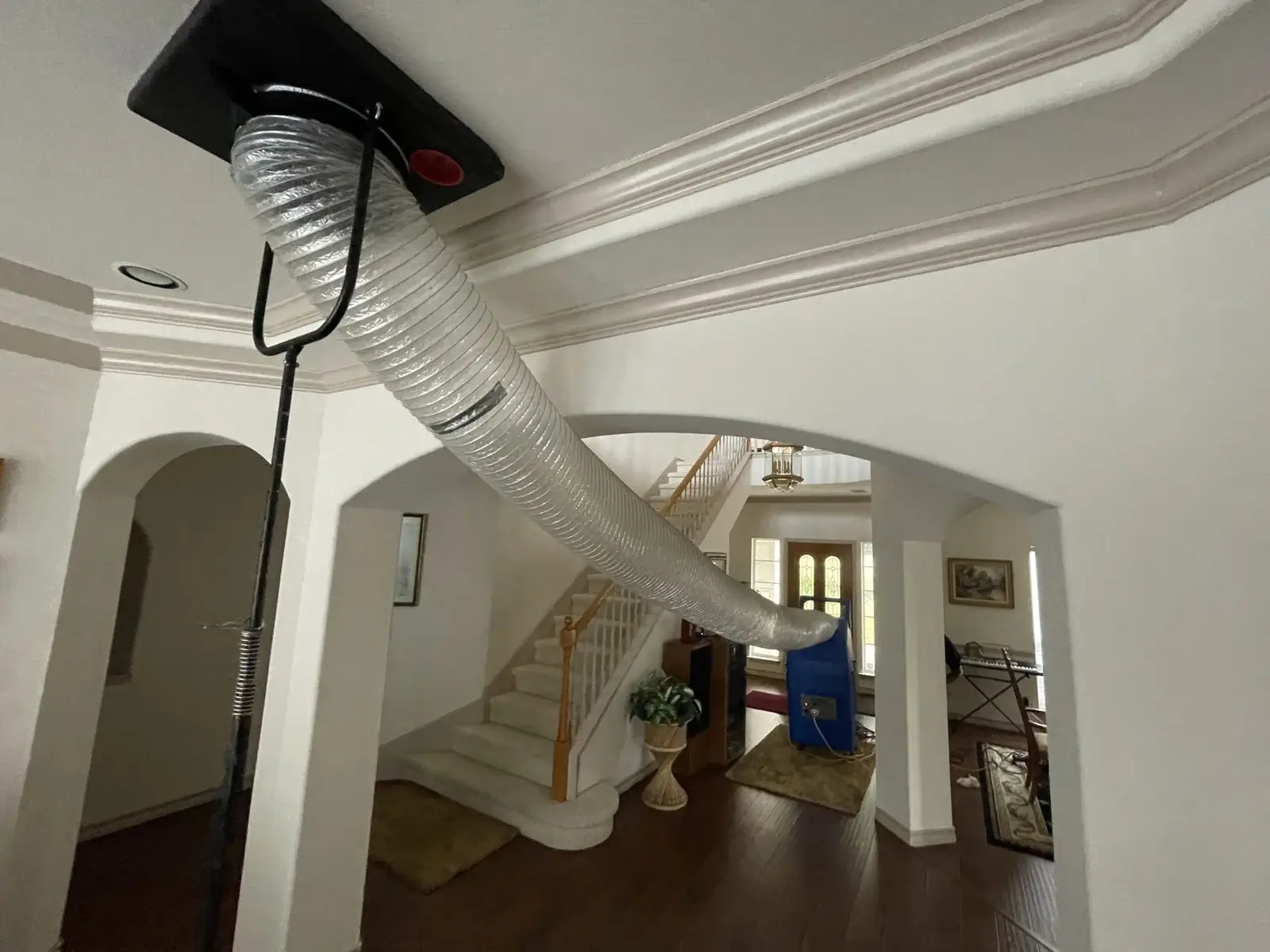 Negative air machine attached to the ceiling